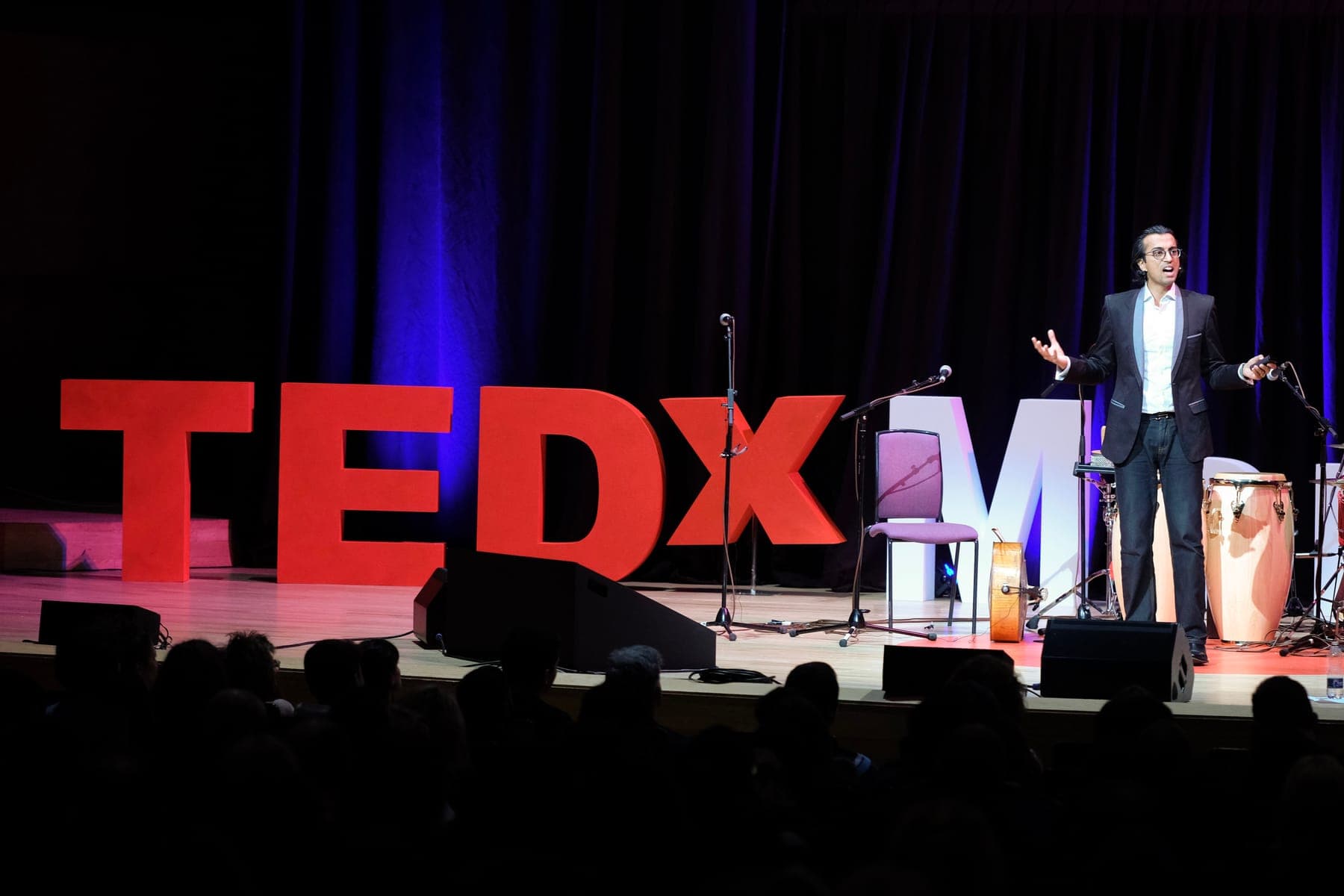 Vikas Shah on stage at TEDx Manchester